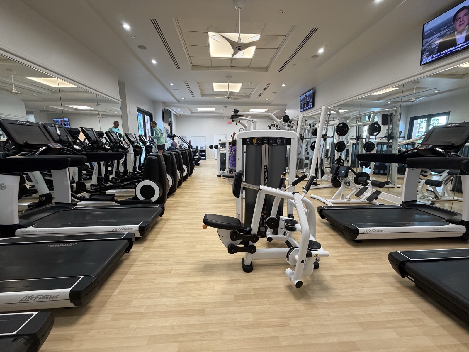 The larger gym at the Walt Disney World Dolphin with rows of Life Fitness treadmills, ellipticals and strength machines