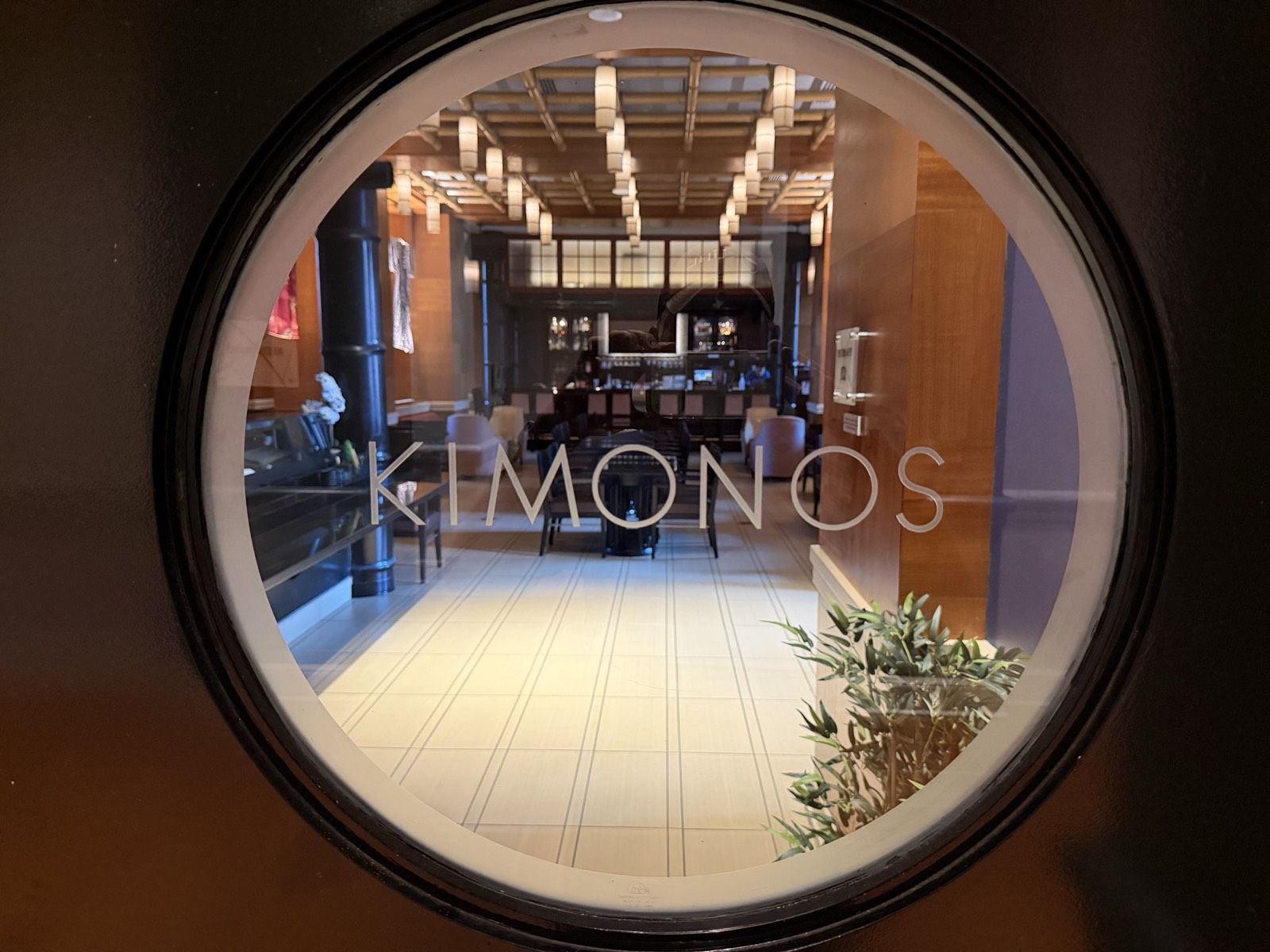 View through the porthole window into Kimonos sushi bar at the Walt Disney World Swan